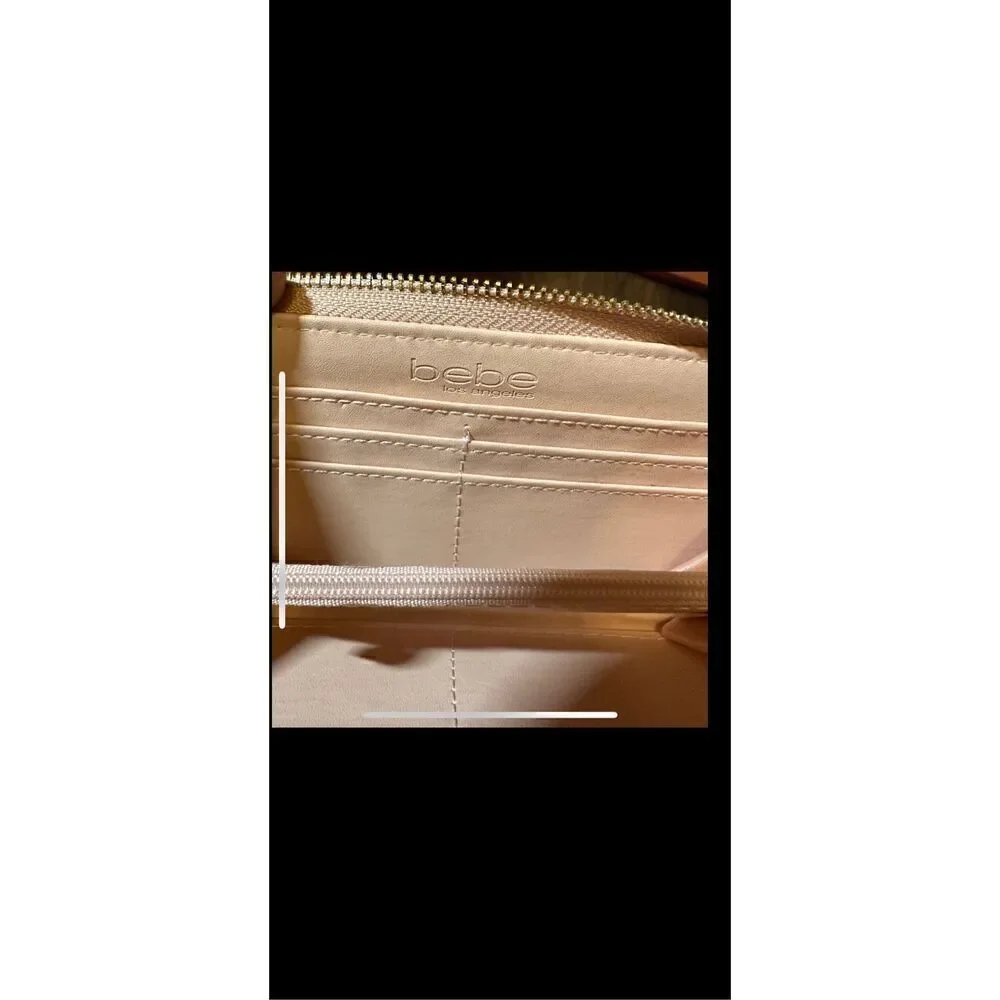 BEBE Pink and gold, large wristlet. Lots of room never used.